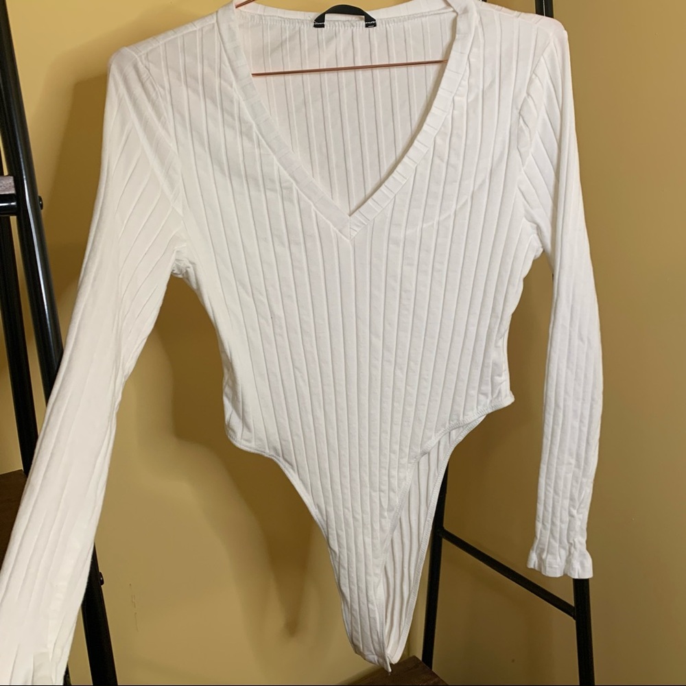 White long sleeved V neck bodysuit